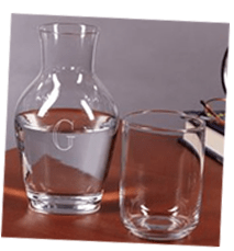 Set out a carafe of water and a glass on the nightstand