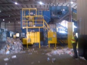 shredded documents being compressed and baled for shipping