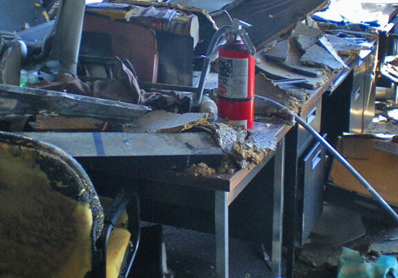 The remains of an office space after it has been decimated by a fire.